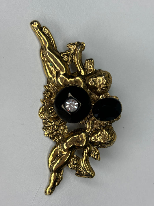 Gold Tone and Black Cherub Brooch