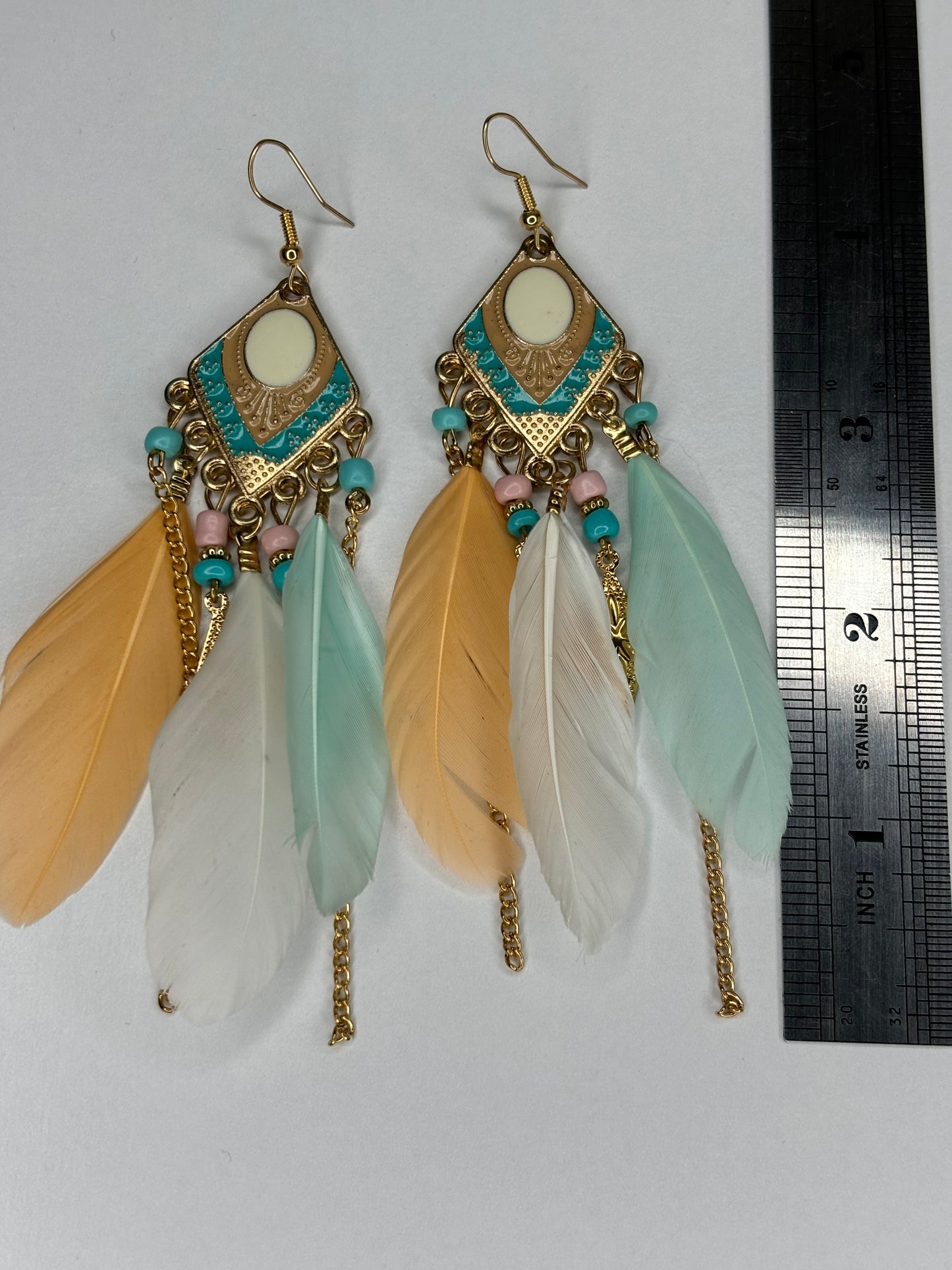 C004 Long 4” Gold Tone and Feather Earrings