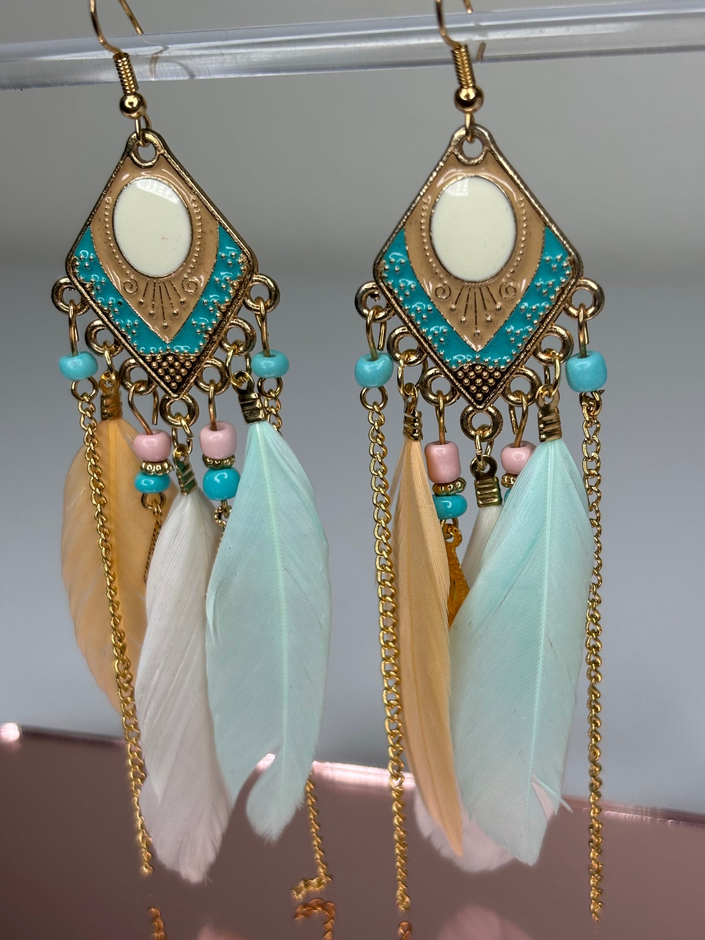 C004 Long 4” Gold Tone and Feather Earrings